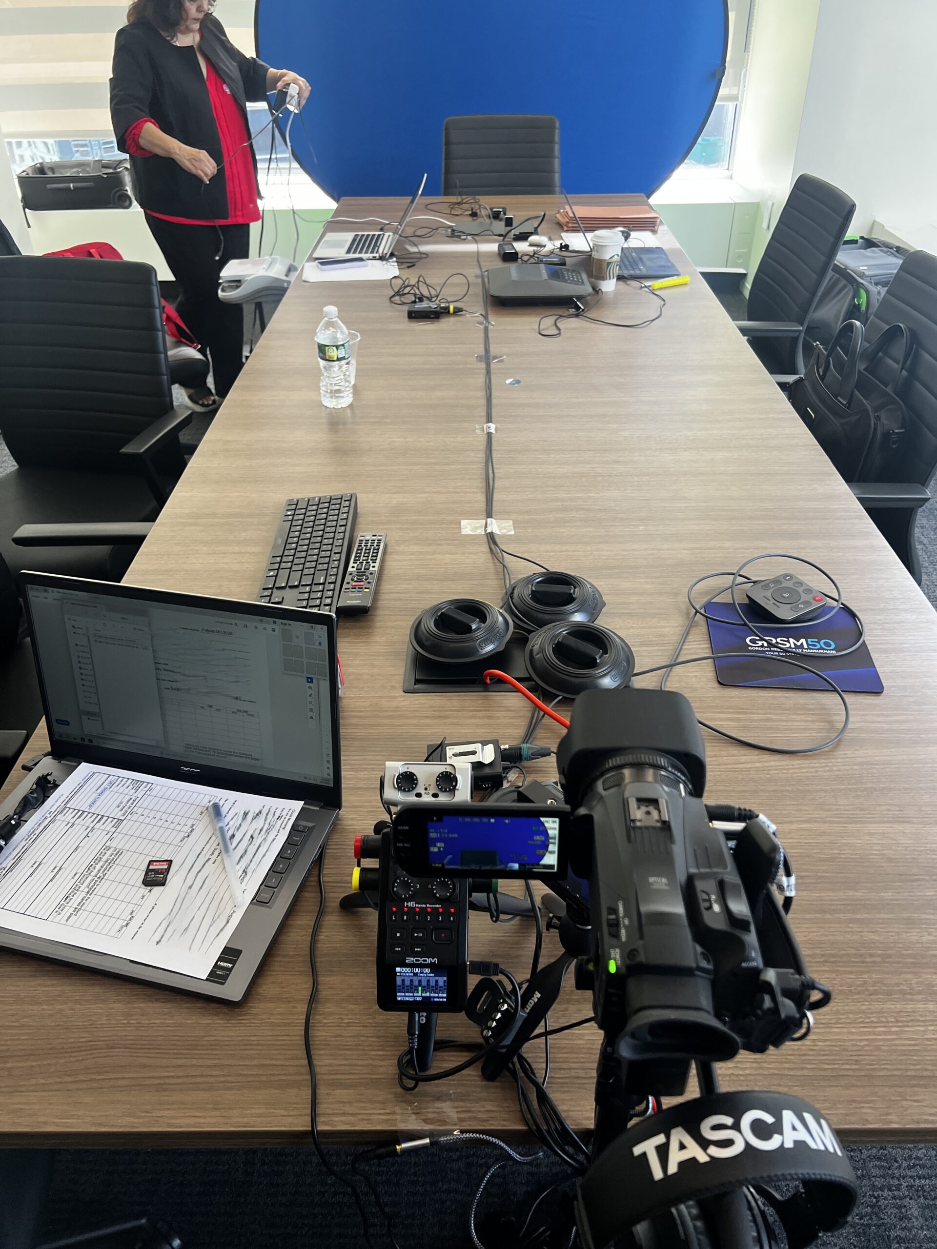Deposition recording gear in use on conference room table
