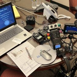 Deposition recording gear in use on conference room table
