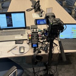 Deposition recording gear in use on conference room table