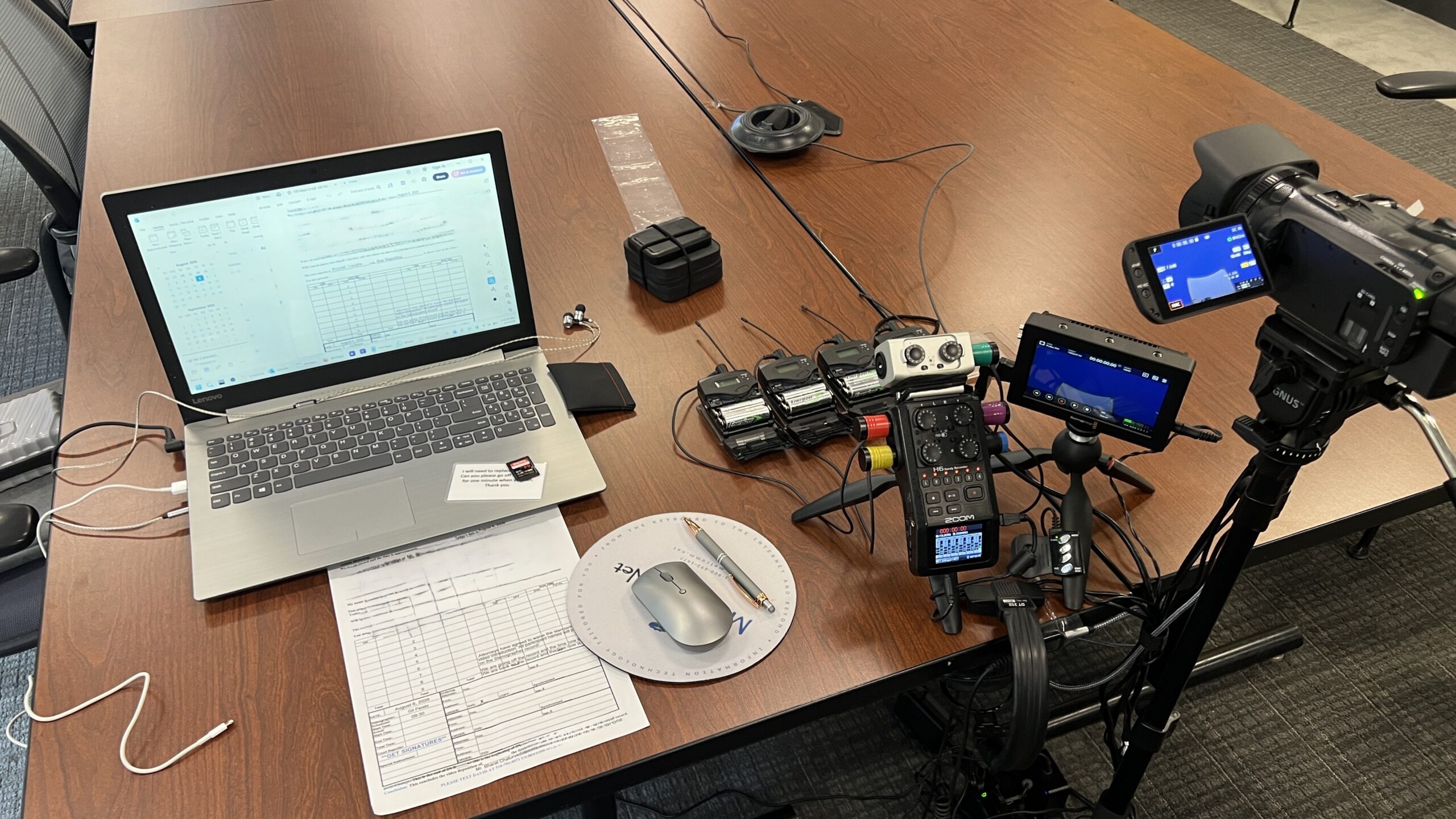 Deposition recording gear in use on conference room table
