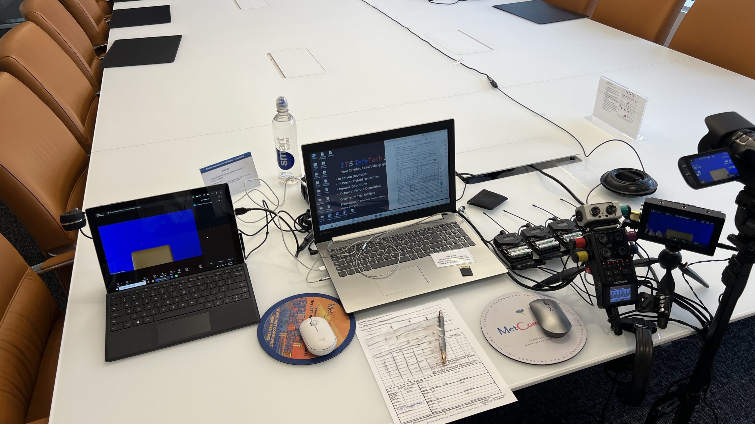 Deposition recording gear in use on conference room table