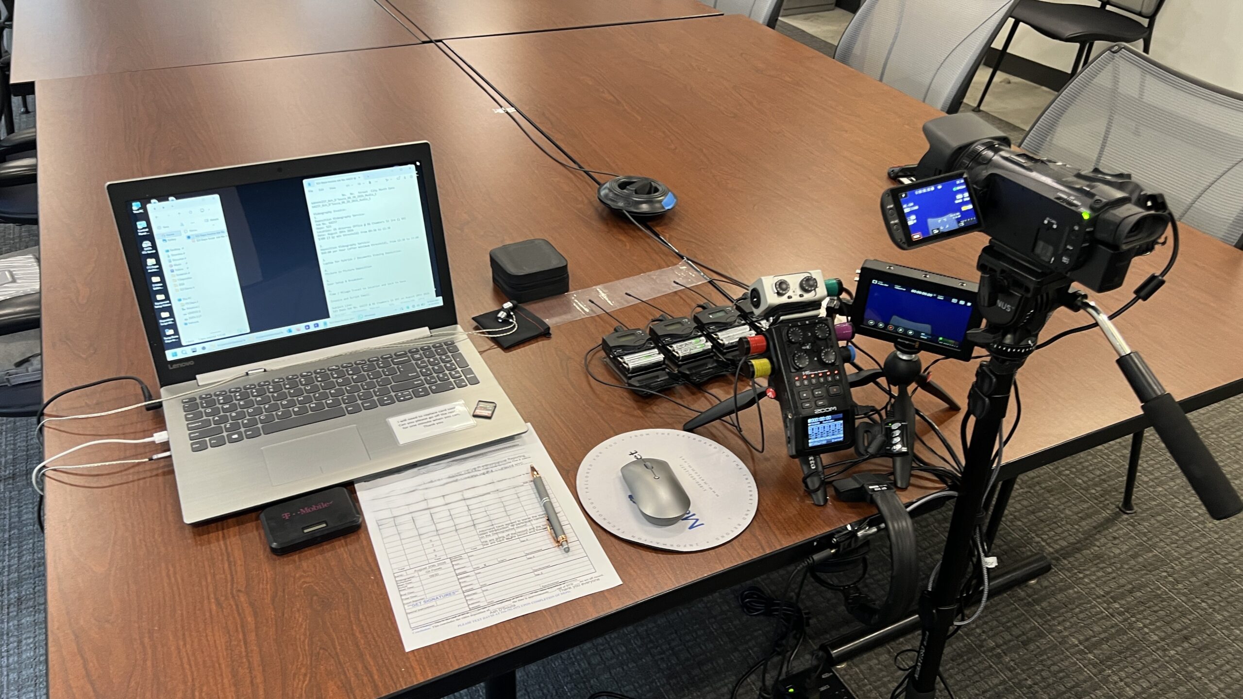 Deposition recording gear in use on conference room table