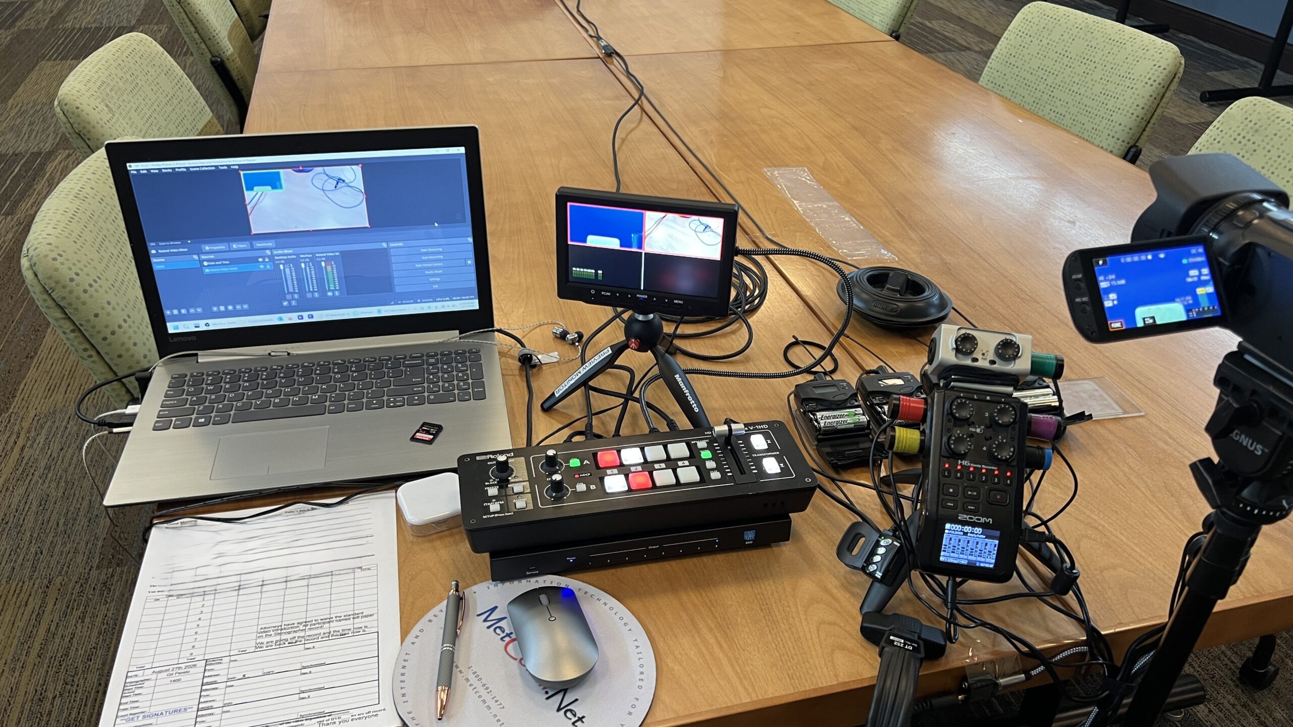 Deposition recording gear in use on conference room table