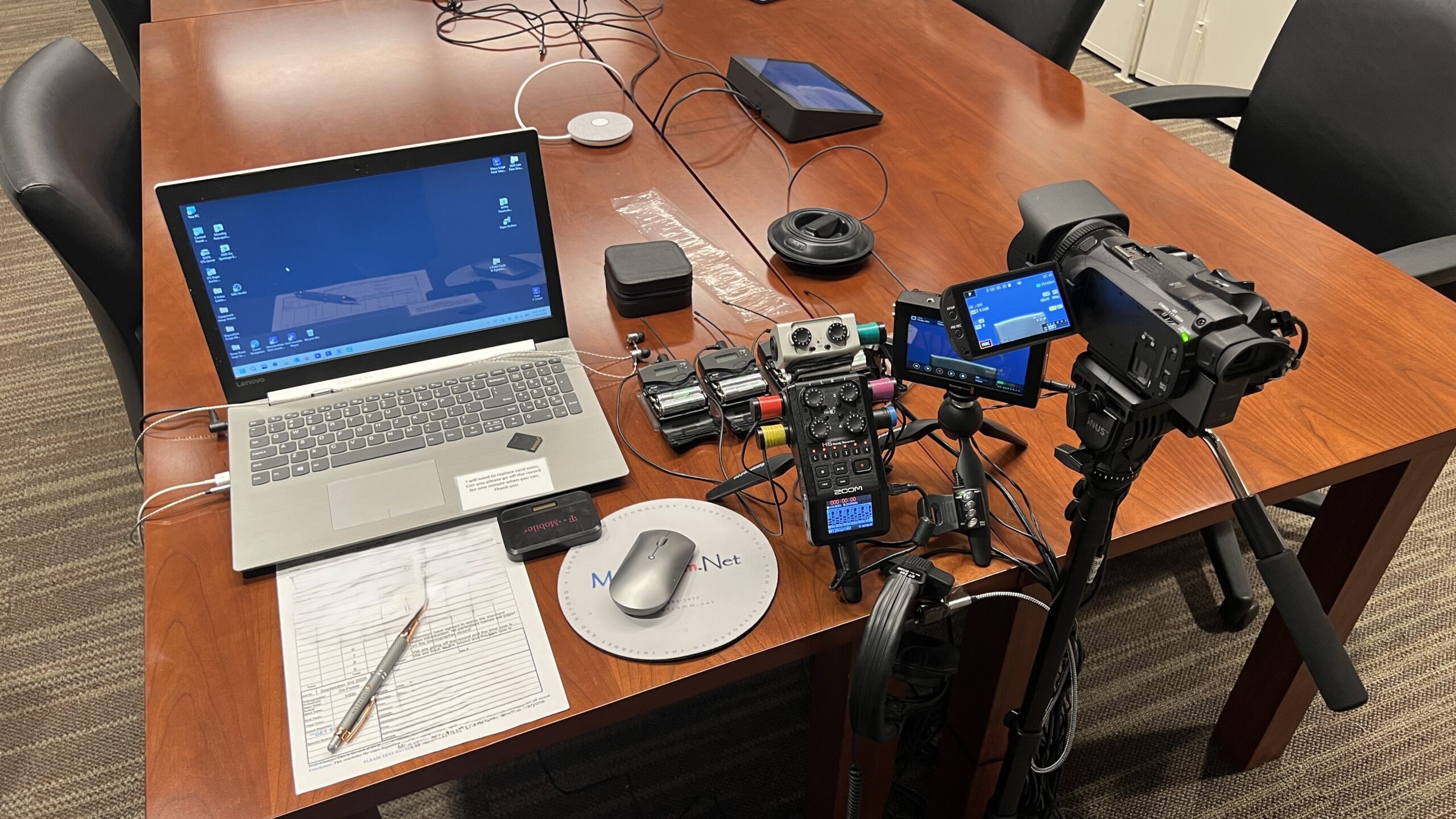 Deposition recording gear in use on conference room table