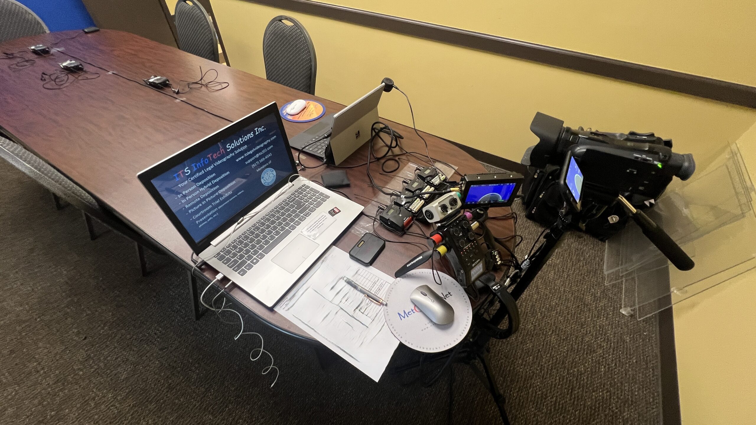Deposition recording gear in use on conference room table