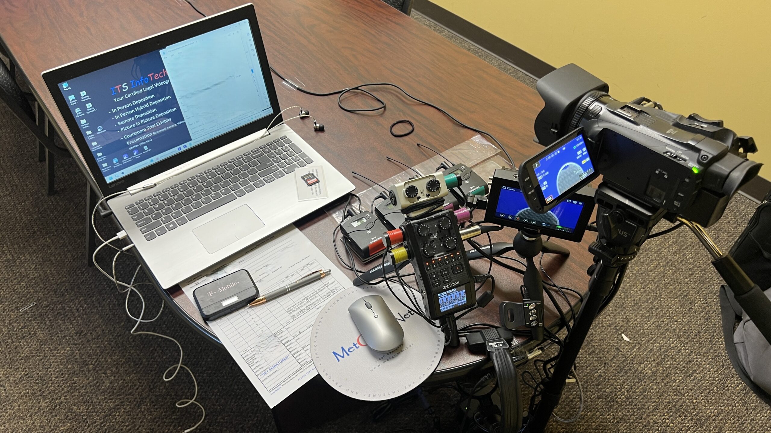 Deposition recording gear in use on conference room table