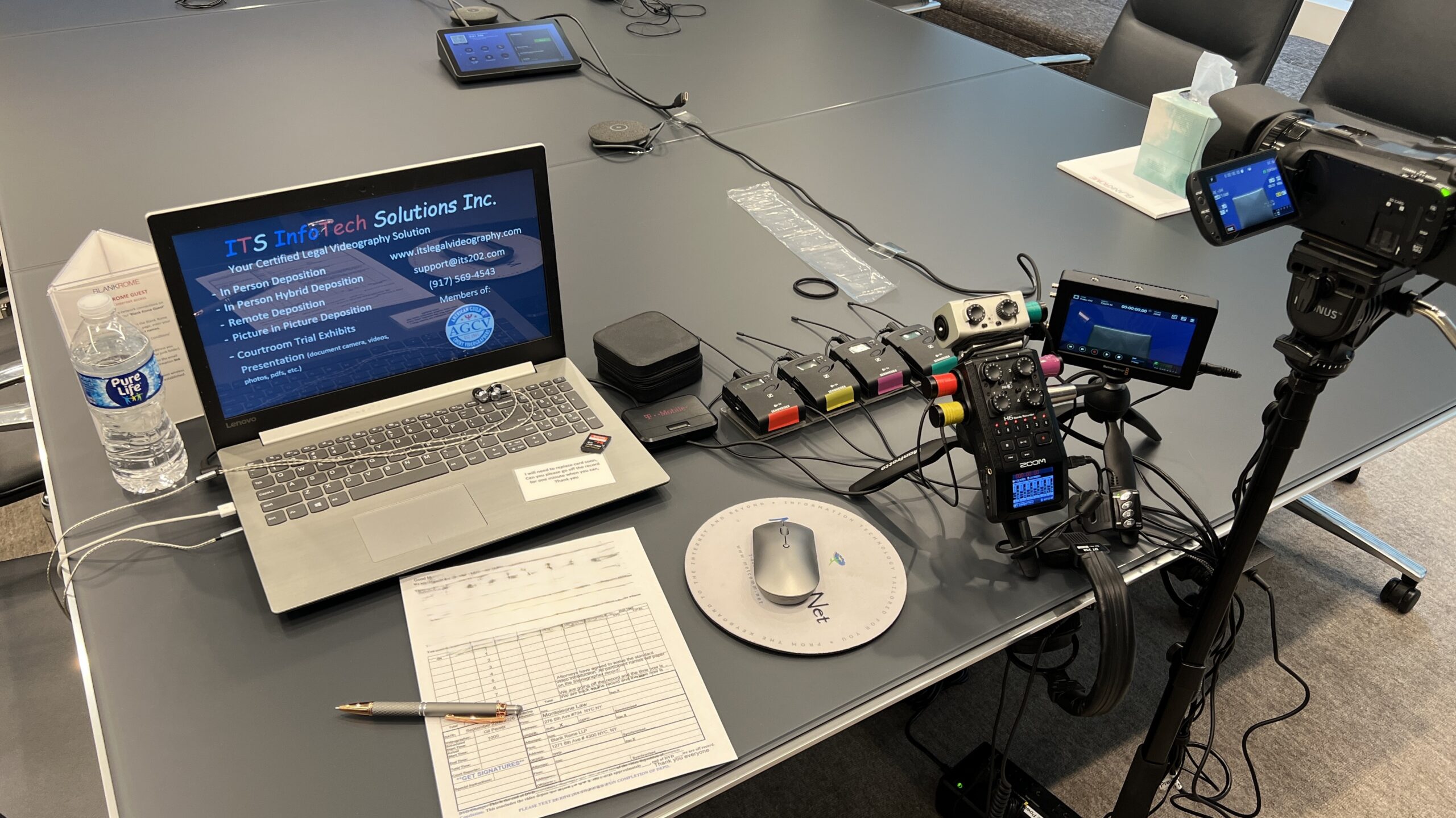 Deposition recording gear in use on conference room table
