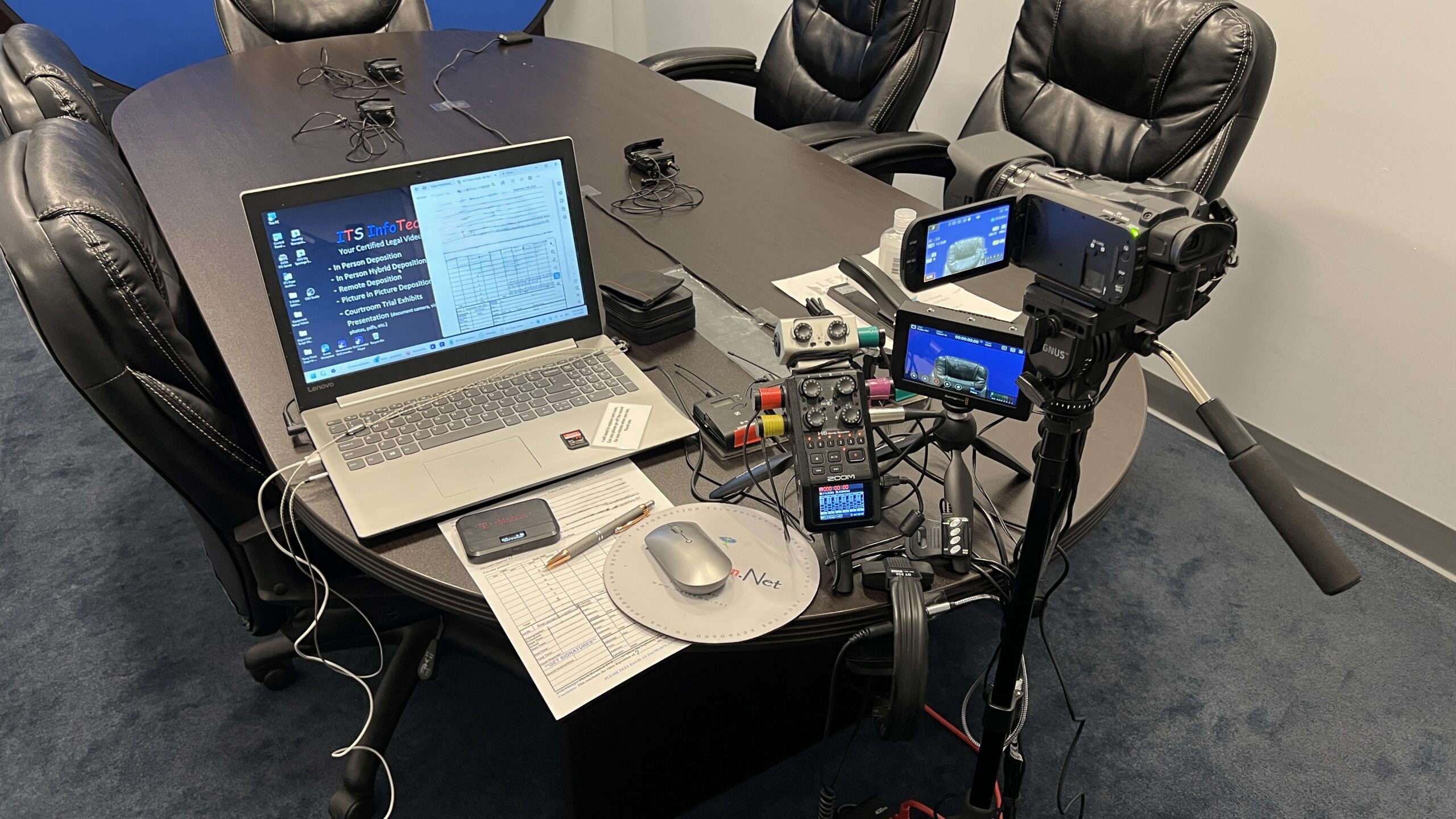 Deposition recording gear in use on conference room table